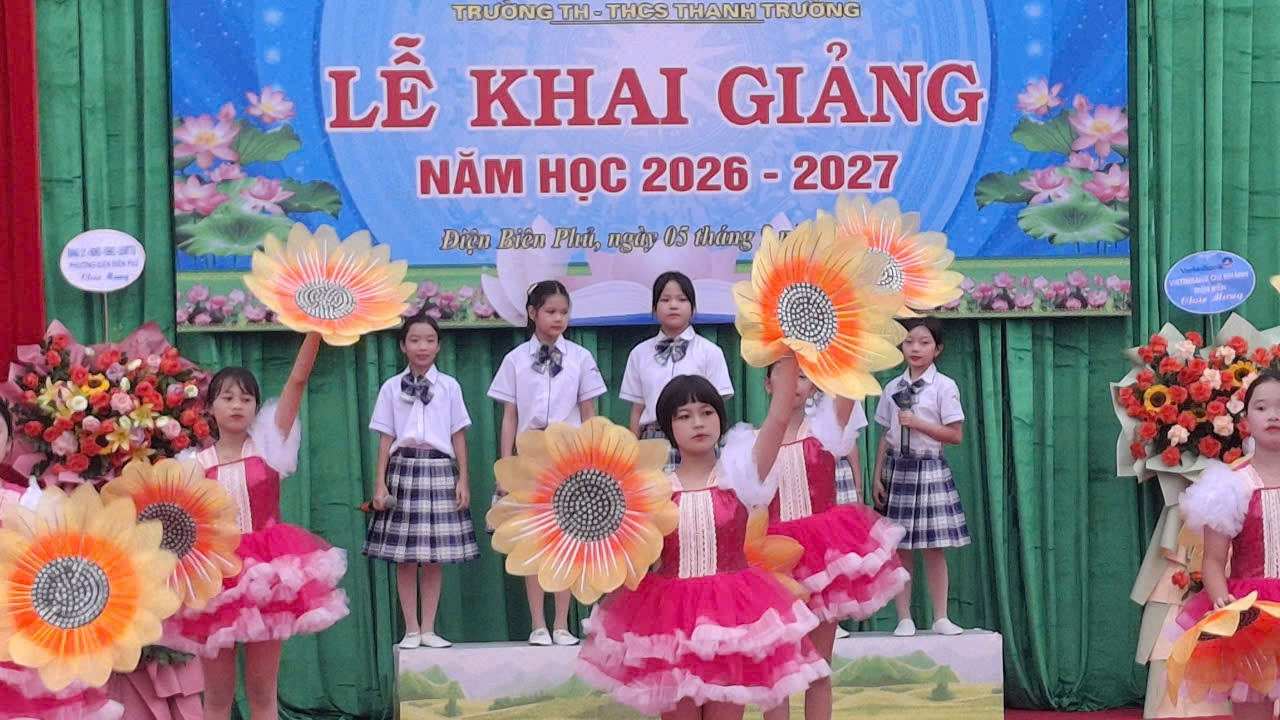 'A group of children on a stage
Description automatically generated'